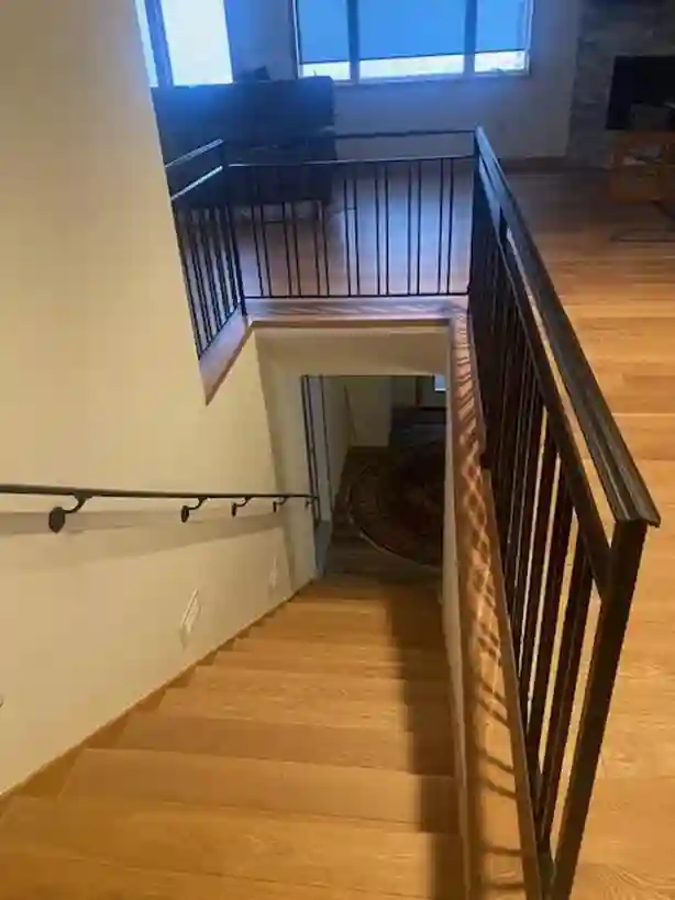 Sweeping wrought iron spiral staircase in a luxury home