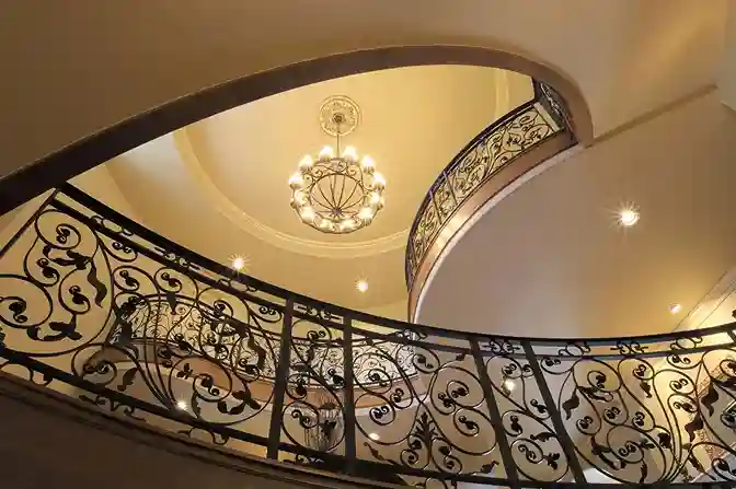 Ornate wrought iron scroll railing in domed rotunda